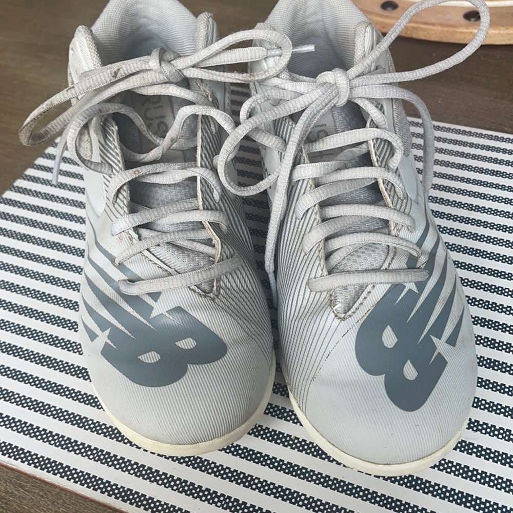 New Balance Rush Cleats